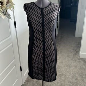 Women’s black dress with pale purple detail on front